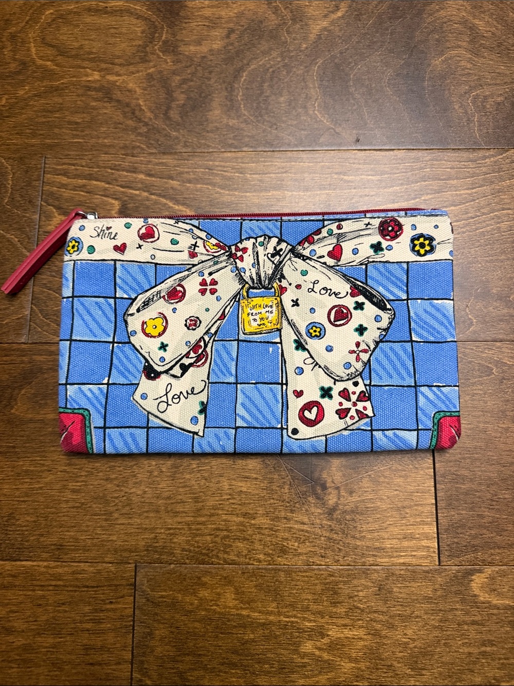 Brighton Blue Grid Clutch with Cream Bow and Red Accents